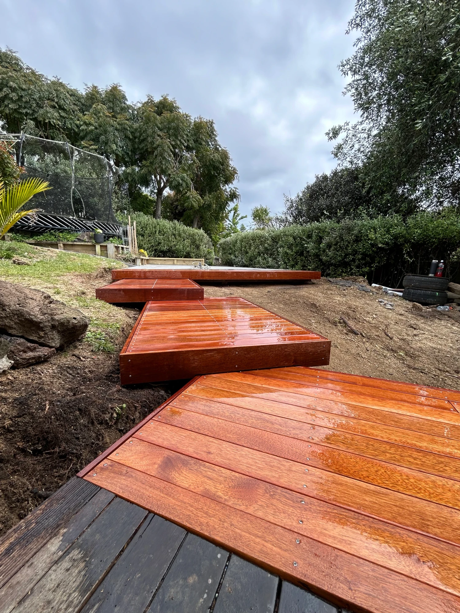 Cascading hardwood deck in Auckland by LSM Construction