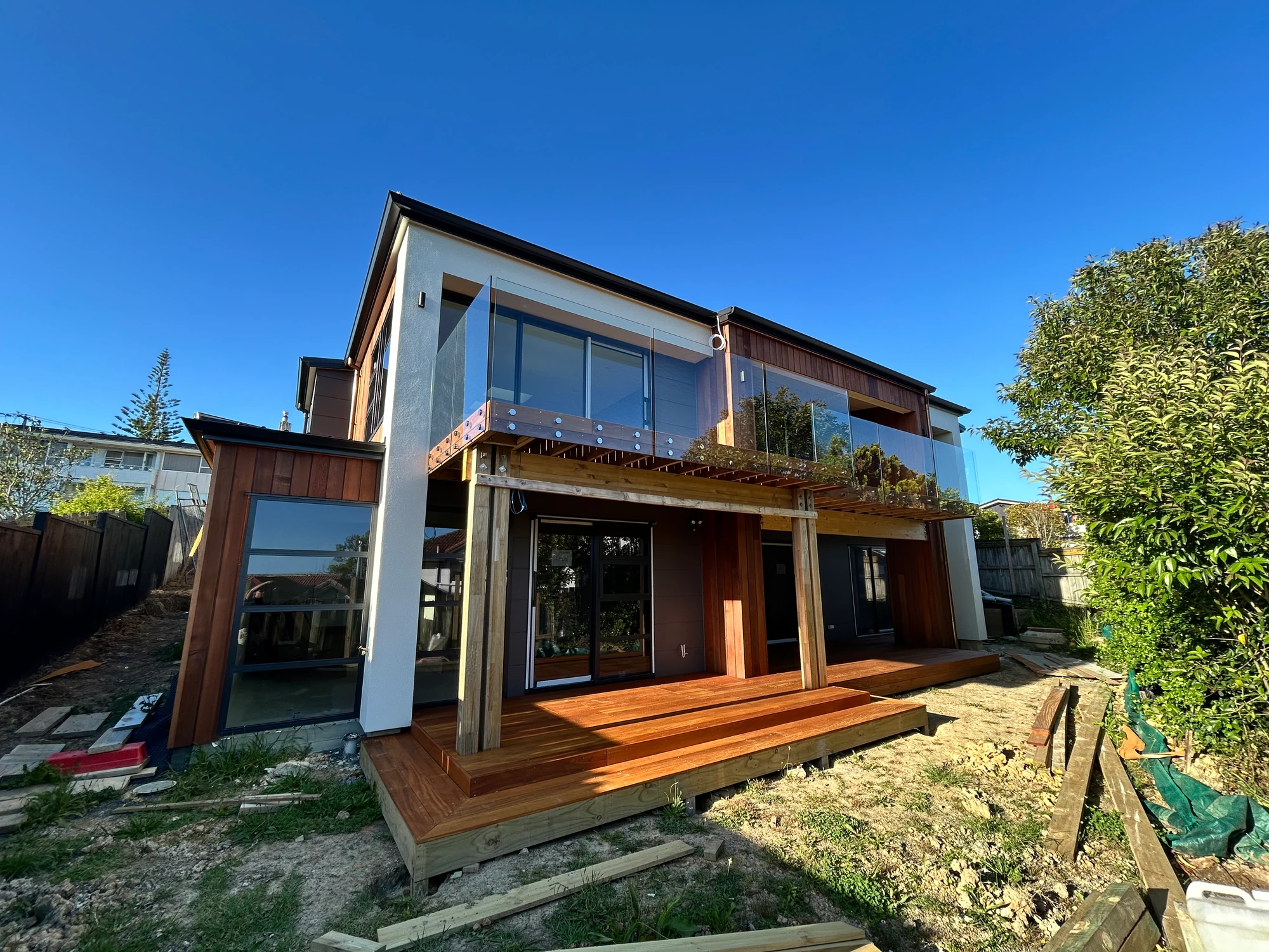 Elevated deck with glass balustrade on a modern Auckland home